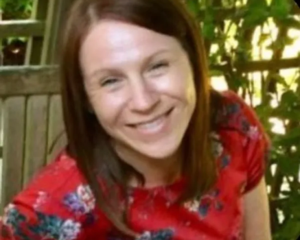 Karen Mitchell, smiling, a client who provided a testimonial about her coaching experience with Sam.